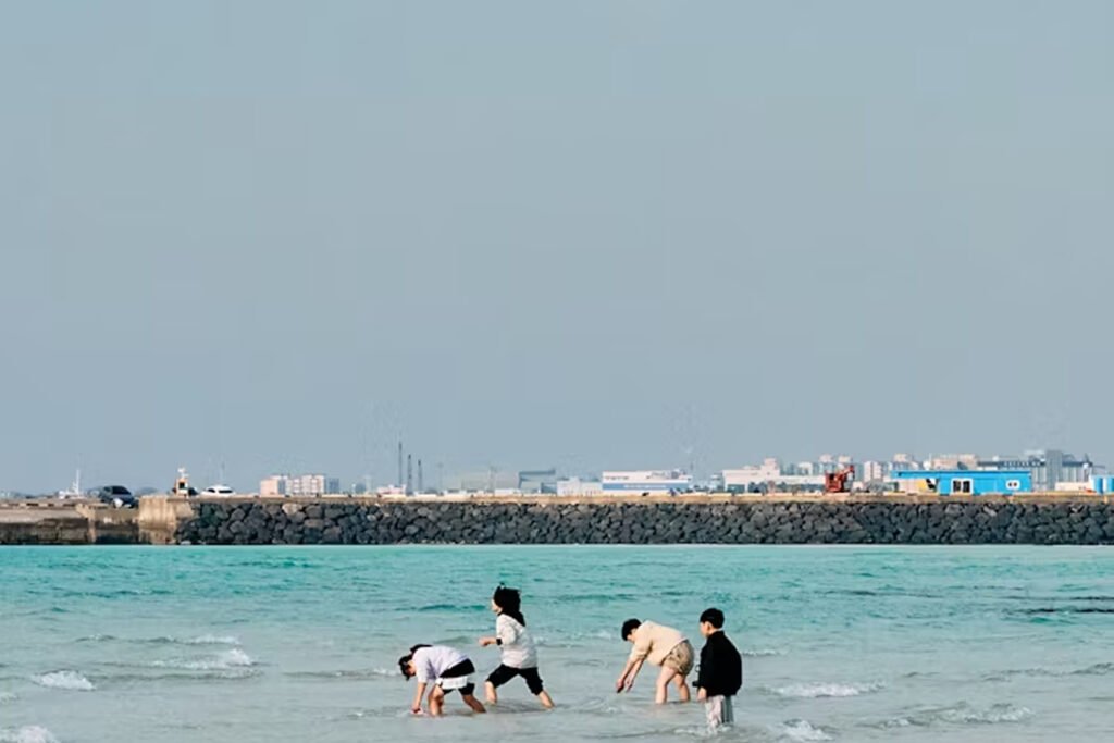 Four kids playing in the water