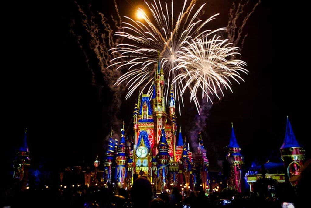 The fireworks happening on the Disney World