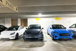 Three cars parked in the parking lot