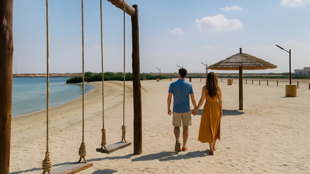 A couple walking along the sandy shores of Umm Al Quwain beach
